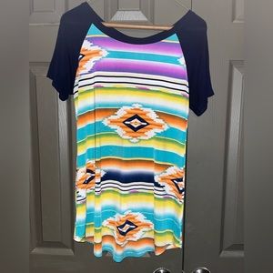 Cute serape and Aztec printed top, lace and buttons are down the back.